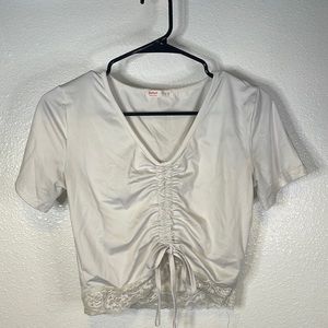 Romwe shirt with scrunched tie and lace at the bottom.